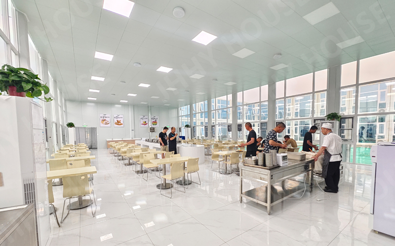 Matching container home to its use A luxury container cabin next to a simple container office